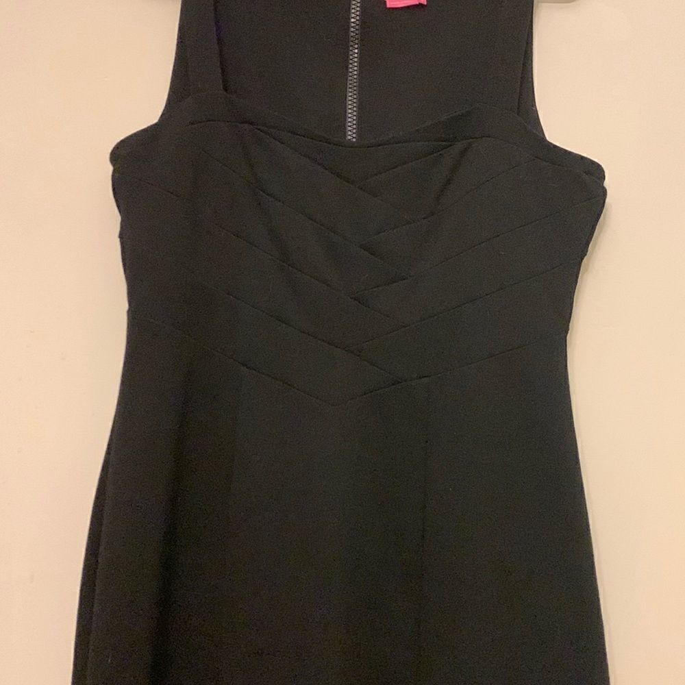 BCBGirls short black sleeveless dress with top half design. Size M Length 33”